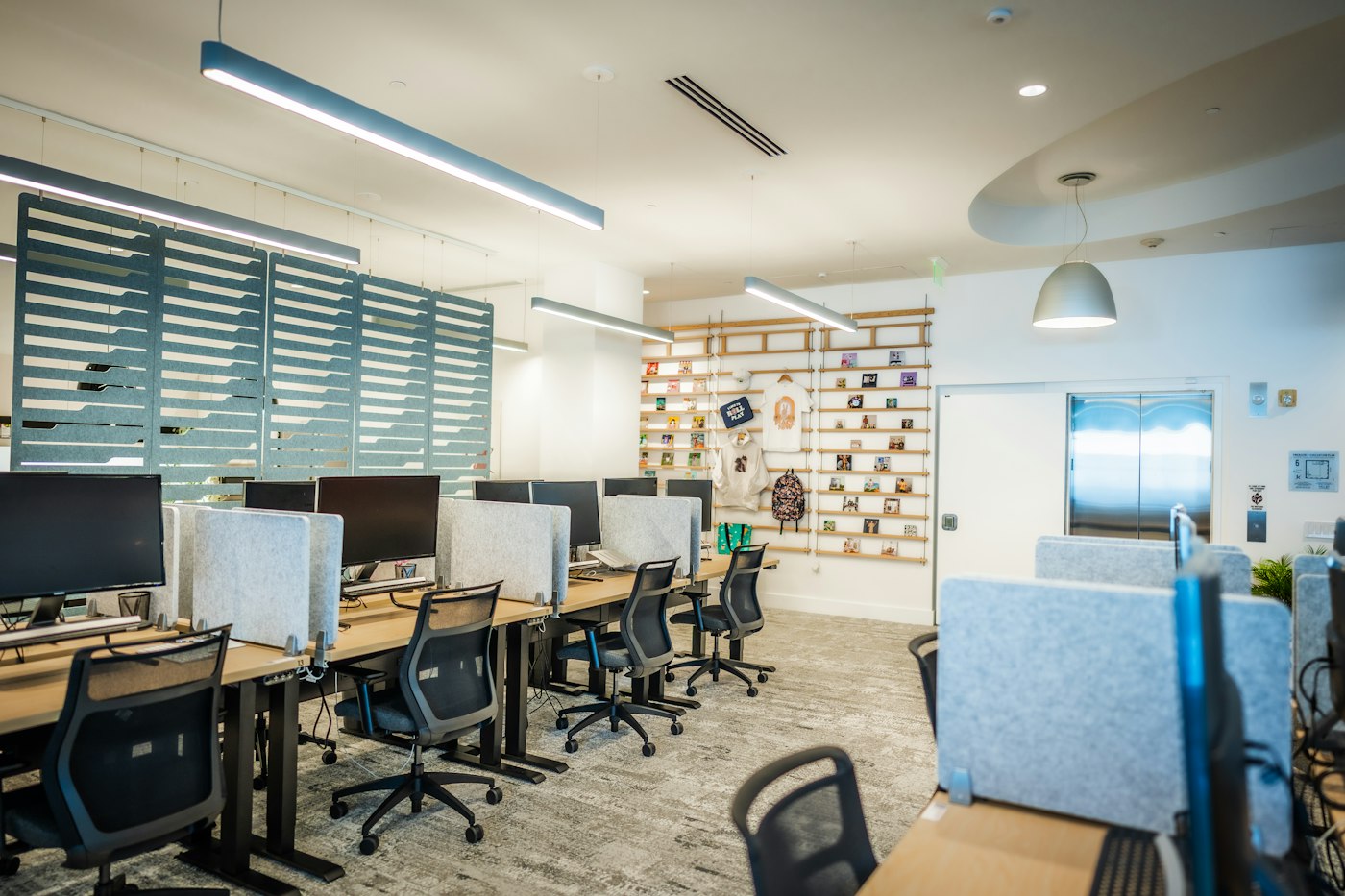 Illustrative stock photo of a modern technology workspace with computer desks